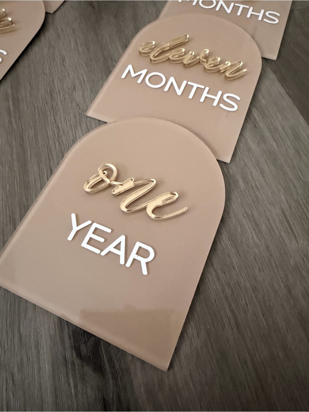 Neutral Tan with Gold accents and white lettering milestones